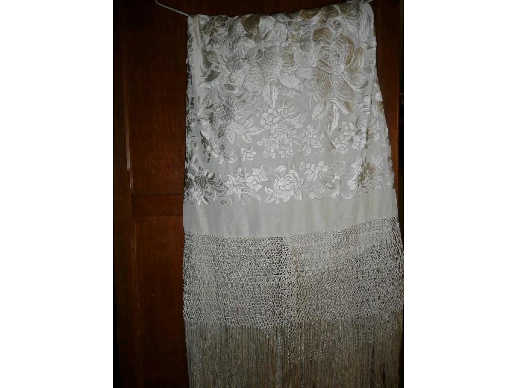 Appraisal: A large vintage cream silk shawl with embroidered flower detail