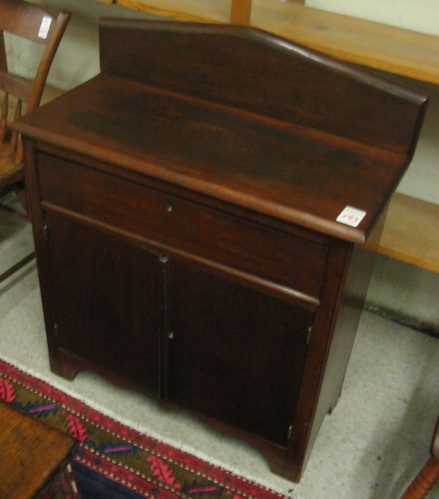 Appraisal: A VICTORIAN WALNUT COMMODE American th century having a plain