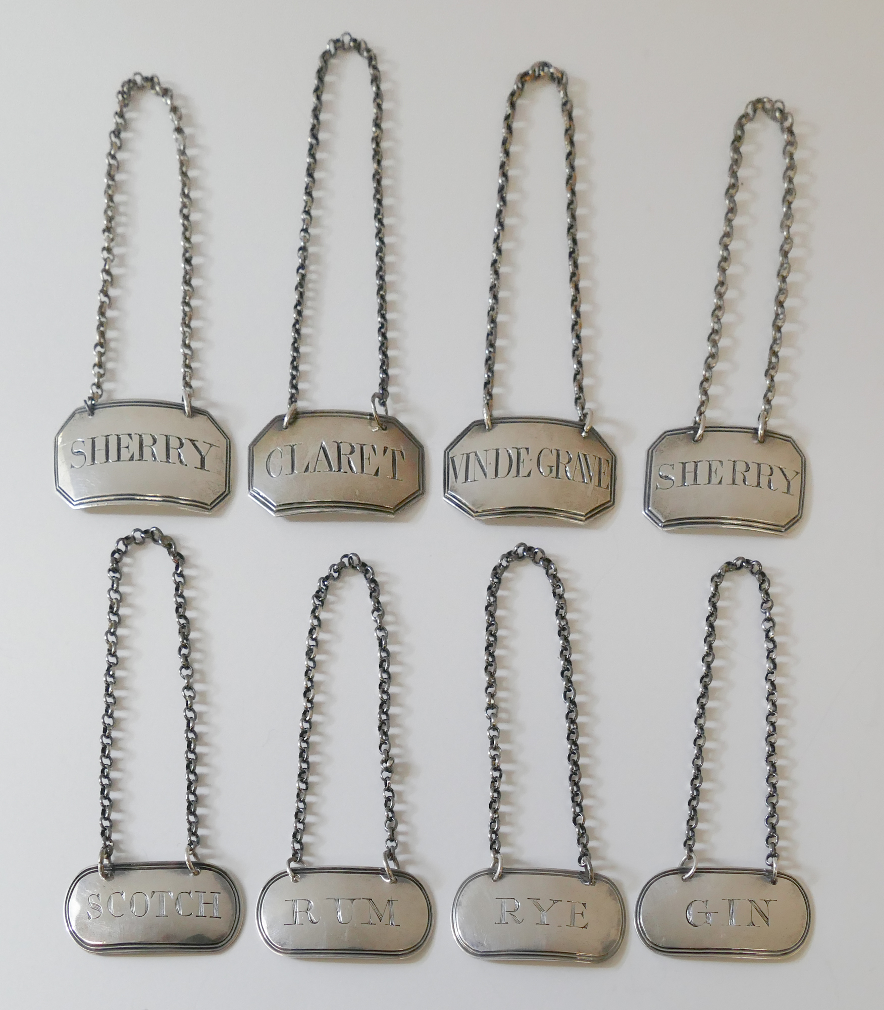 Appraisal: pc English Georgian Sterling Bottle Tickets Includes sets with pc