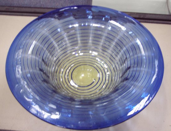 Appraisal: A blue glass dish with trailed spiral decoration cm diameter