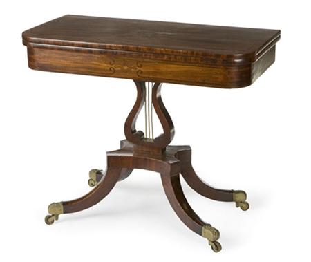 Appraisal: A Regency mahogany tea table the frieze inlaid with scroll