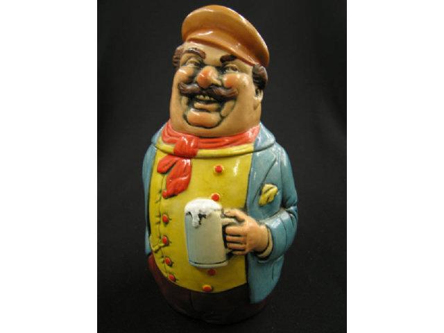 Appraisal: German Figural Pottery Character Stein man holding a stein excellent