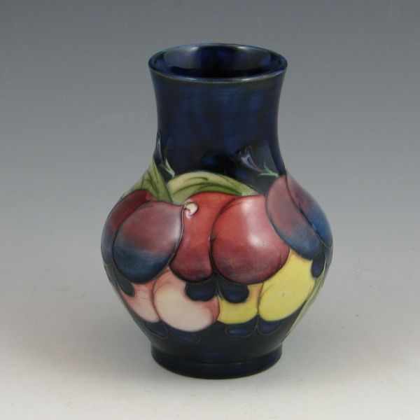 Appraisal: Moorcroft vase with floral decoration on a cobalt blue background