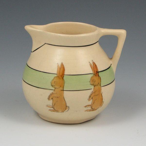 Appraisal: Roseville Juvenile ball creamer with standing rabbits Marked with a