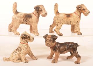 Appraisal: Four Various Hubley Dog Figures Pair of Wire Haired Fox