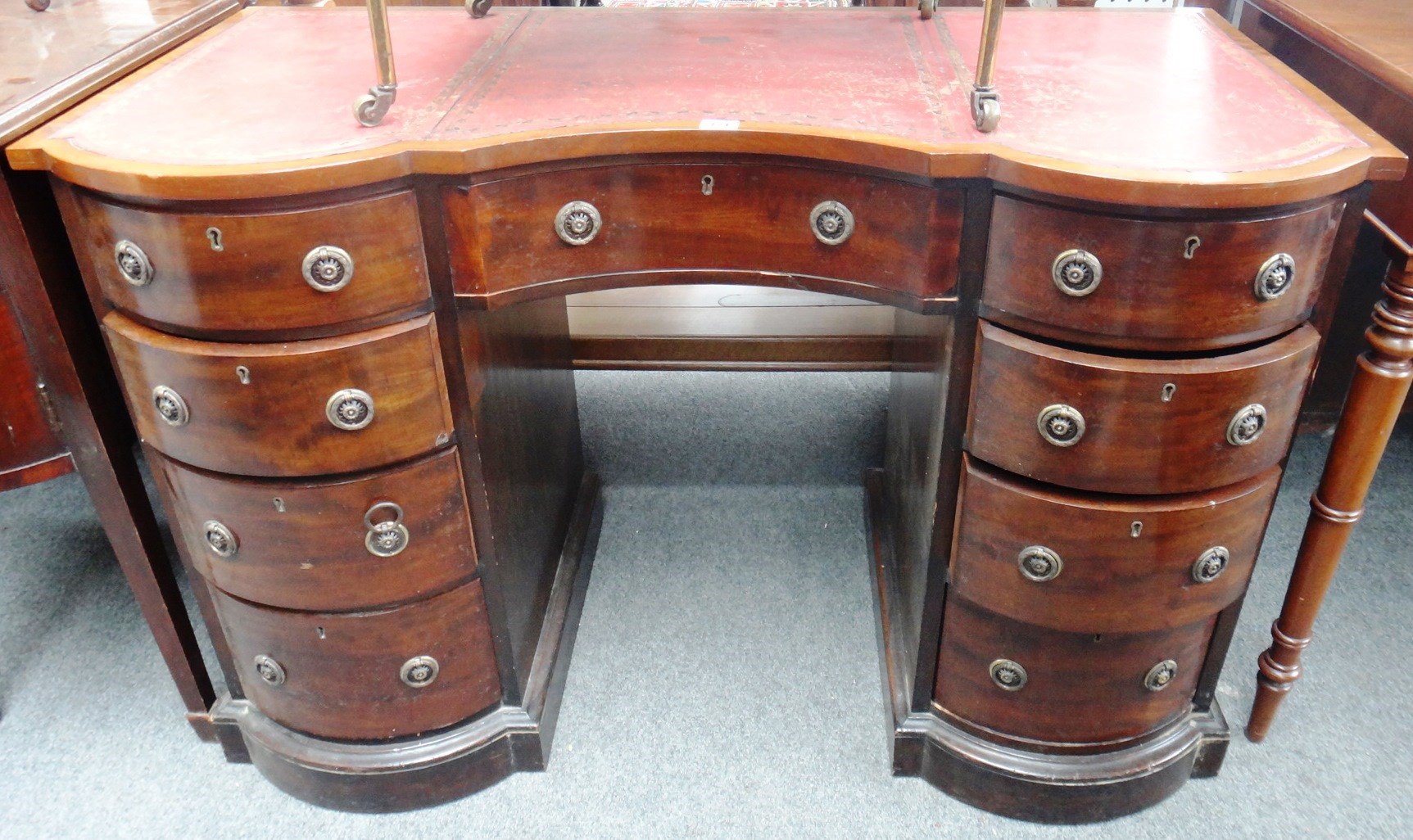 Appraisal: A late th century mahogany double bowfront writing desk with