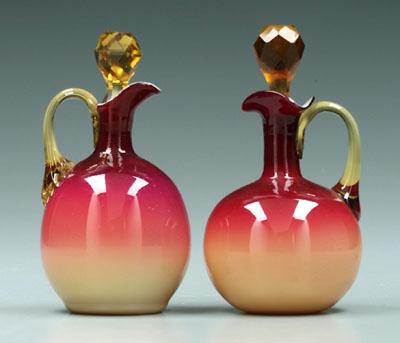 Appraisal: Two Wheeling peachblow cruets glossy finish amber stoppers and handles