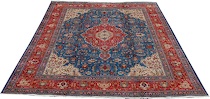 Appraisal: A Tabriz Carpet Red oblong medallion with an ivory pendant