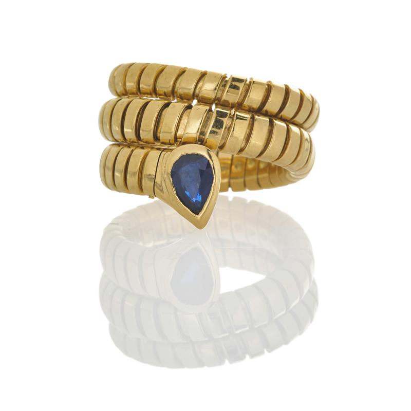 Appraisal: BULGARI TUBOGAS GOLD AND SAPPHIRE SERPENT RING Flexible coiled k