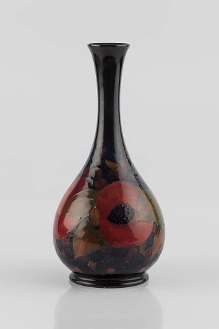 Appraisal: William Moorcroft British - 'Pomegranate' vaseunderglazed green signature and stamped