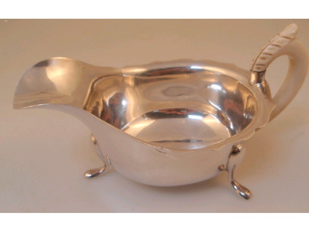 Appraisal: An Edward VIII silver sauce boat by Viners with oge