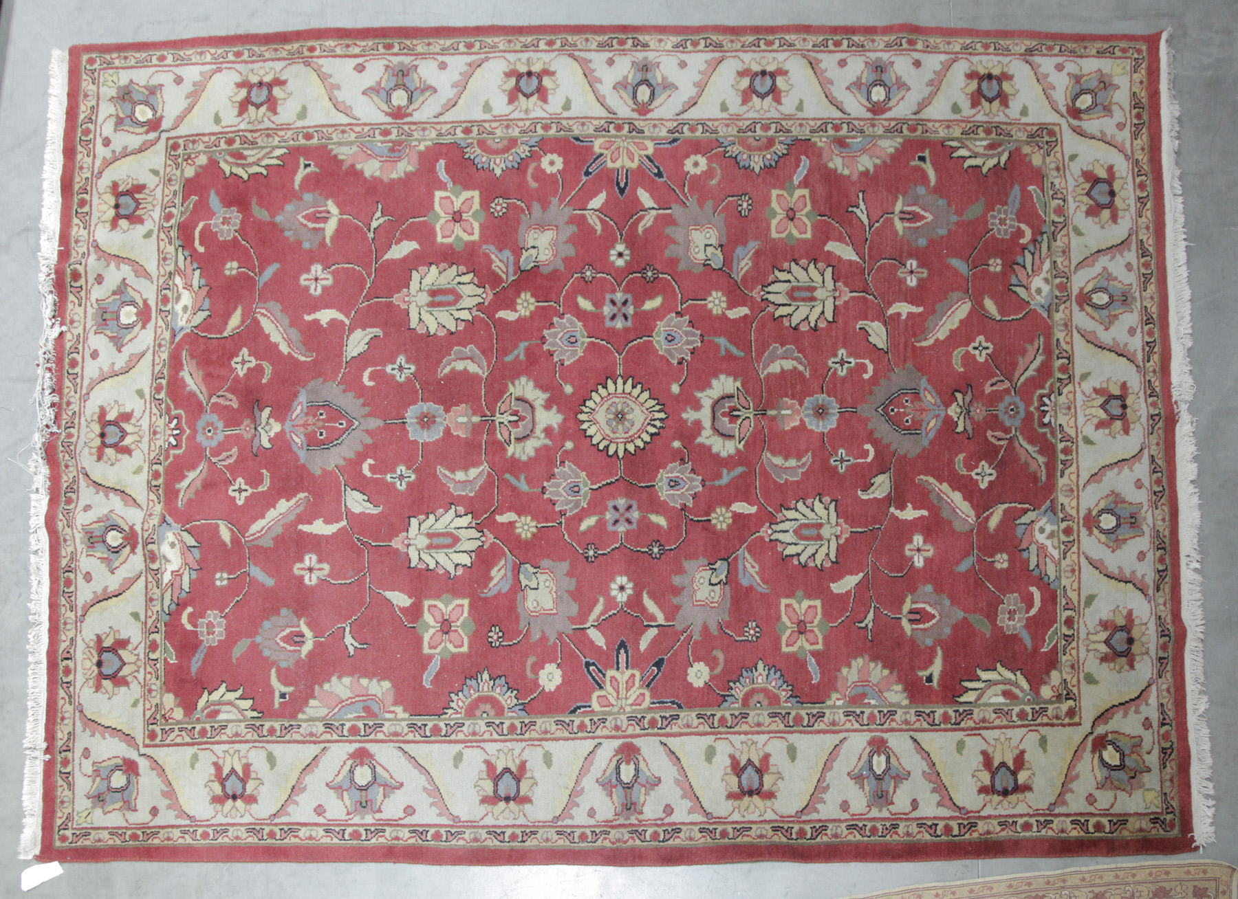 Appraisal: ROOMSIZE ORIENTAL RUG India th century wool Floral with salmon