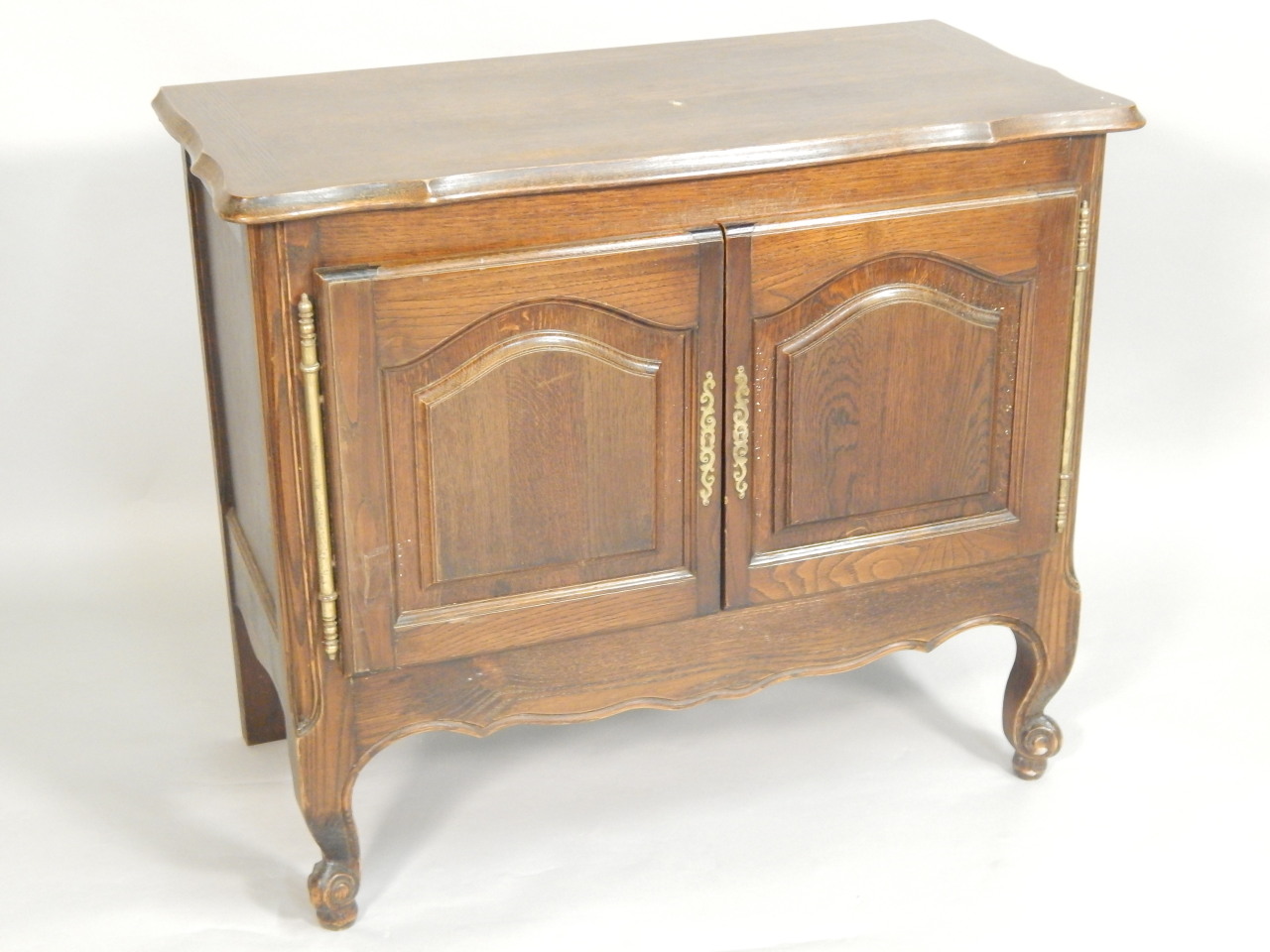 Appraisal: An early thC French oak side cabinet the serpentine shaped