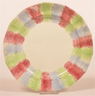 Appraisal: Rainbow Spatter Ironstone China Paneled Plate Alternating bands of red