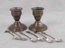 Appraisal: A pair of white metal tests silver candlesticks approx cm