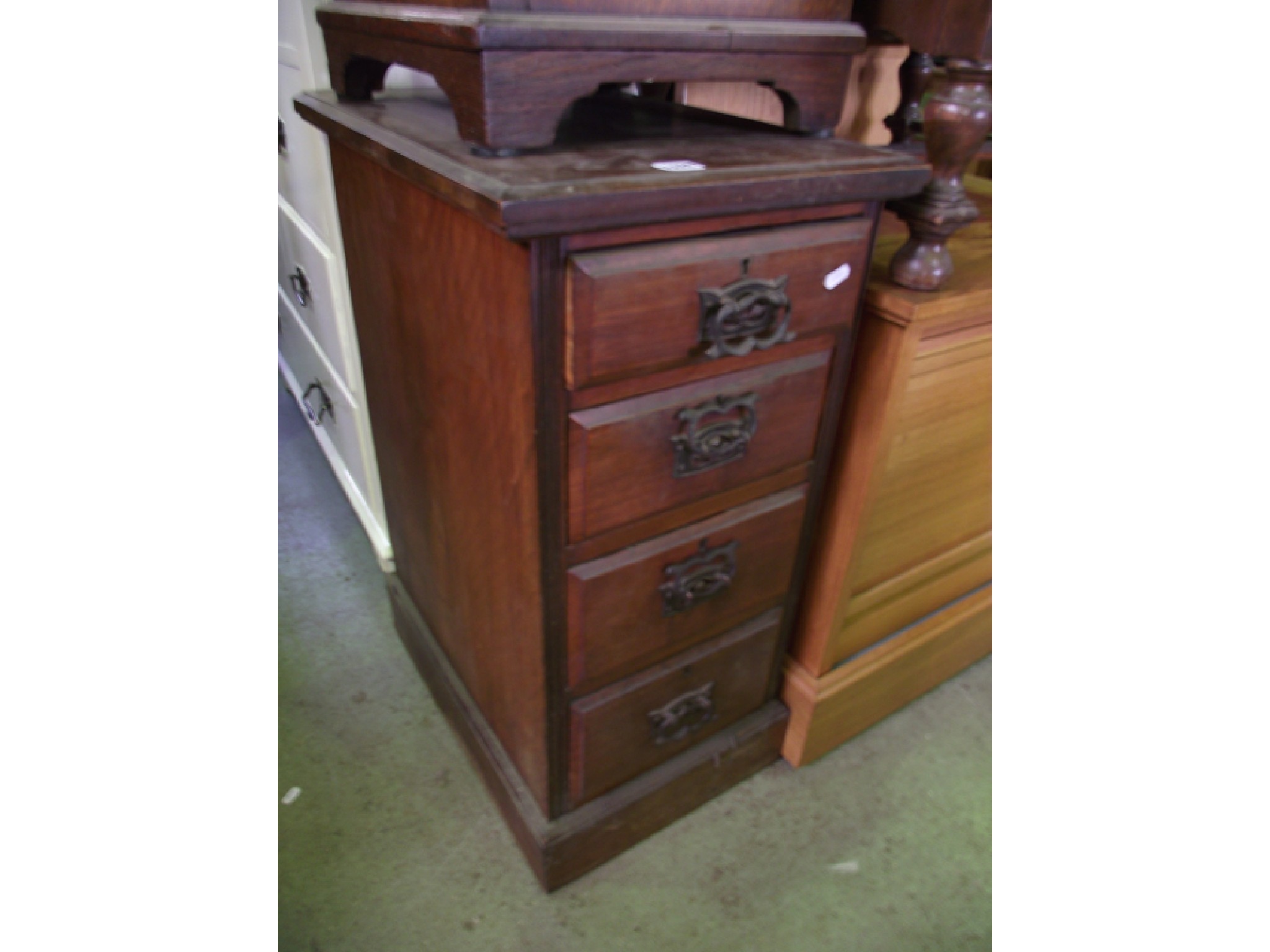 Appraisal: A tower of four drawers with embossed Art Nouveau handles