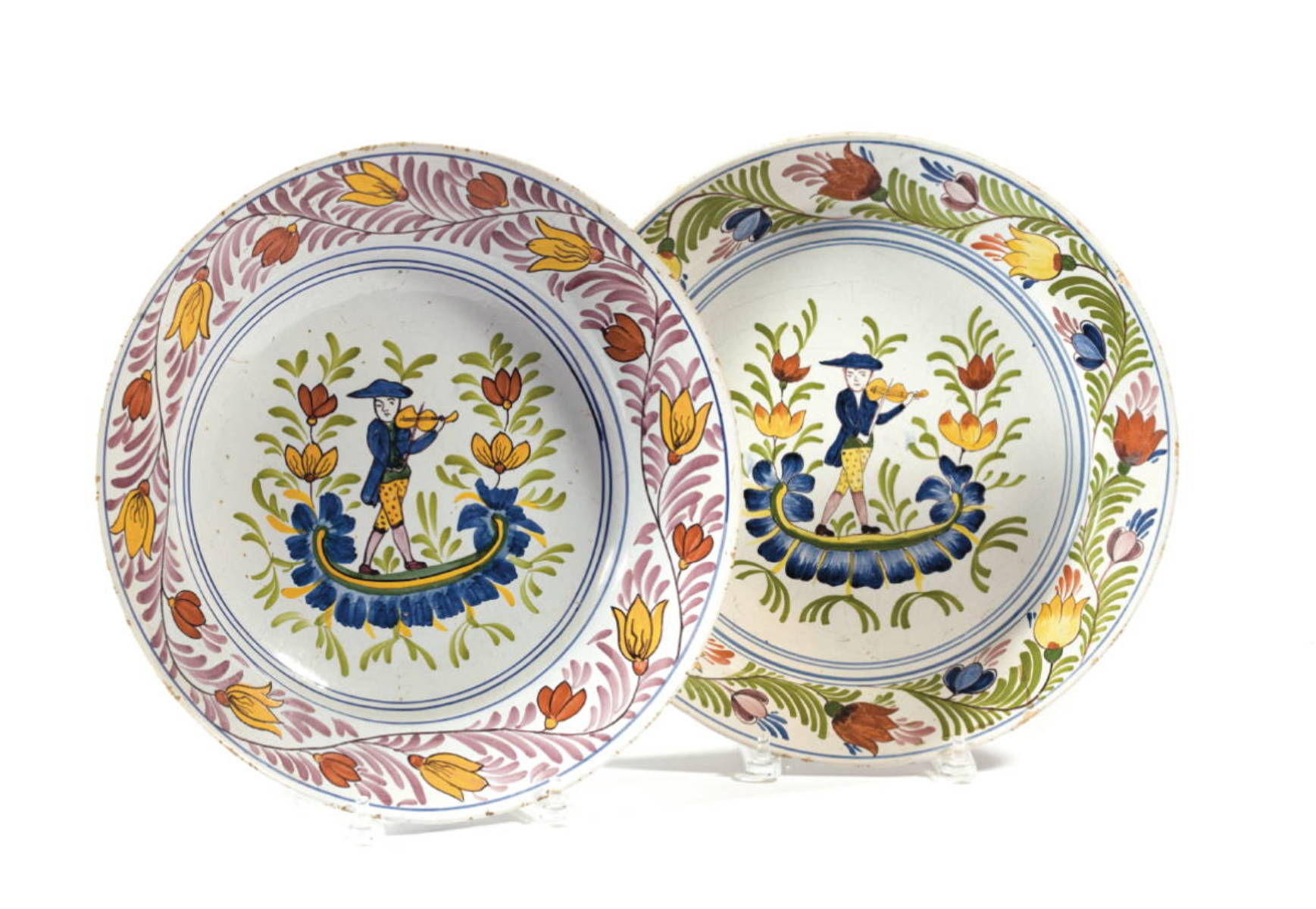 Appraisal: TWO SIMILAR DUTCH DELFT POLYCHROME DISHES EIGHTEENTH CENTURY Each painted