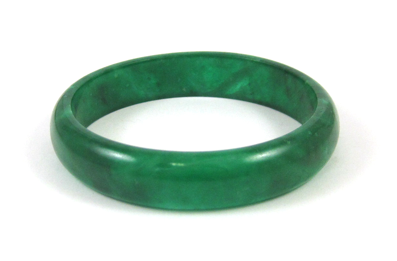 Appraisal: GREEN HARDSTONE BANGLE weighing grams and measuring inch wide and