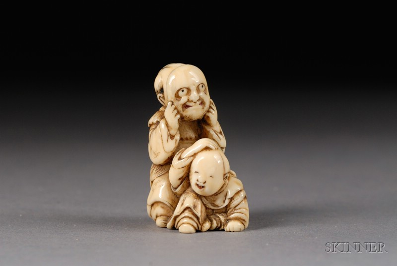 Appraisal: Ivory Netsuke th century two children playing with a mask