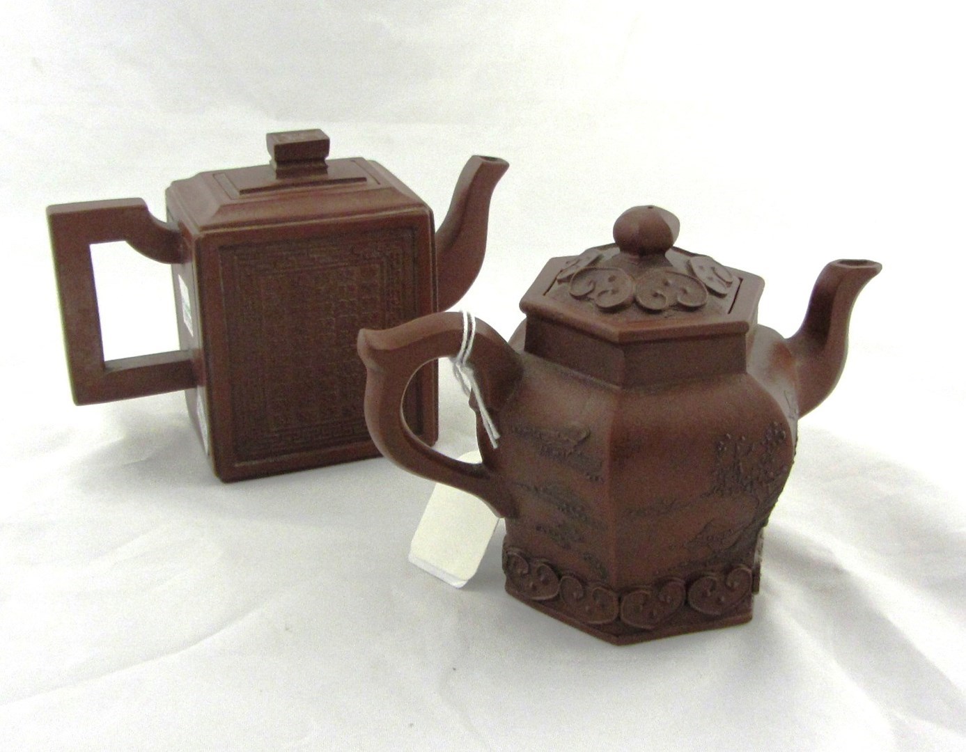 Appraisal: A Chinese Yixing hexagonal teapot and cover th century decorated