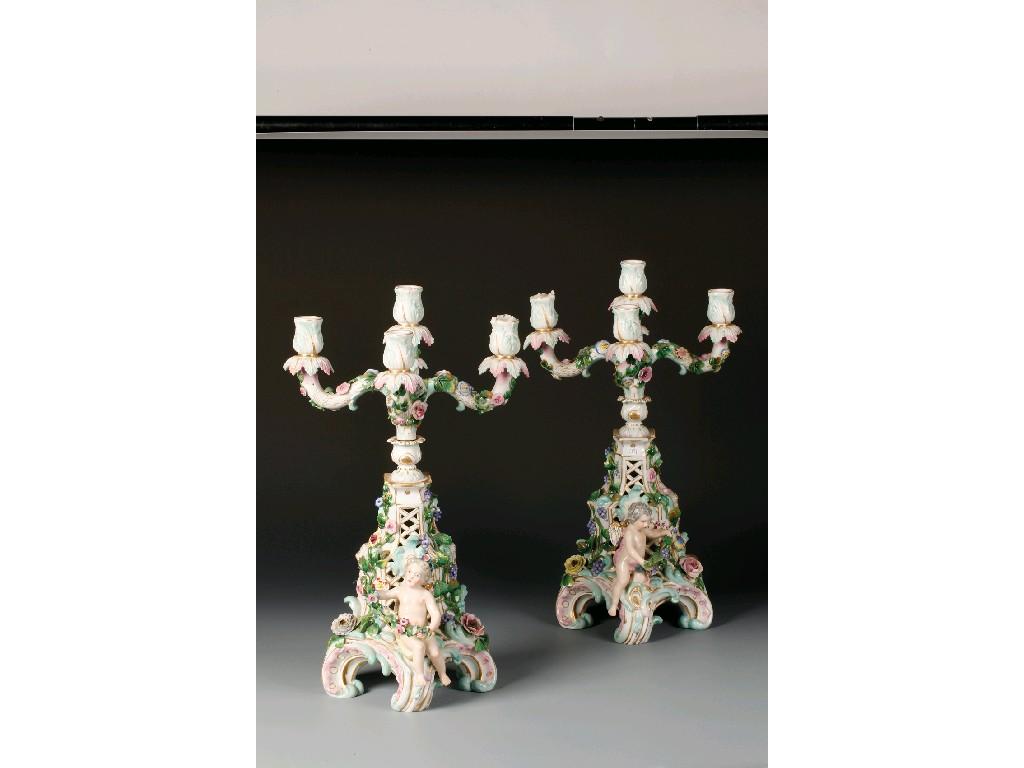 Appraisal: A PAIR OF DRESDEN PORCELAIN THREE BRANCH TABLE CANDELABRA the