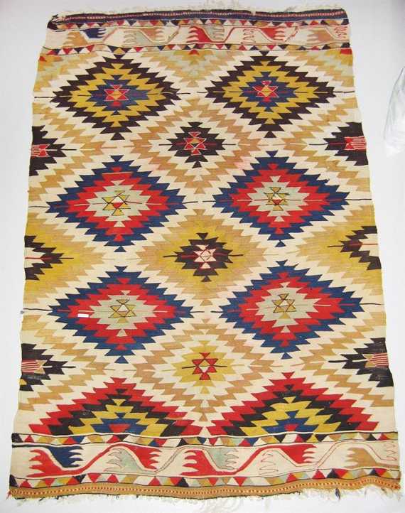 Appraisal: ANATOLIAN KILIM old Central field divided into serrated lozenges signs