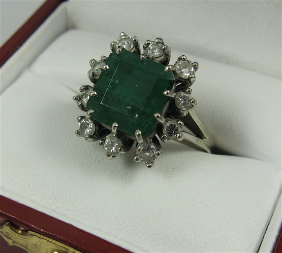 Appraisal: EMERALD DIAMOND AND K WHITE GOLD RING with appraisal Centering