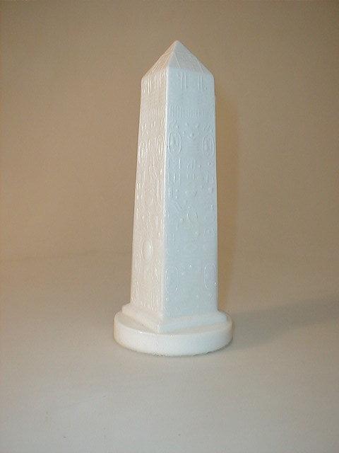 Appraisal: A Victorian white pressed glass obelisk