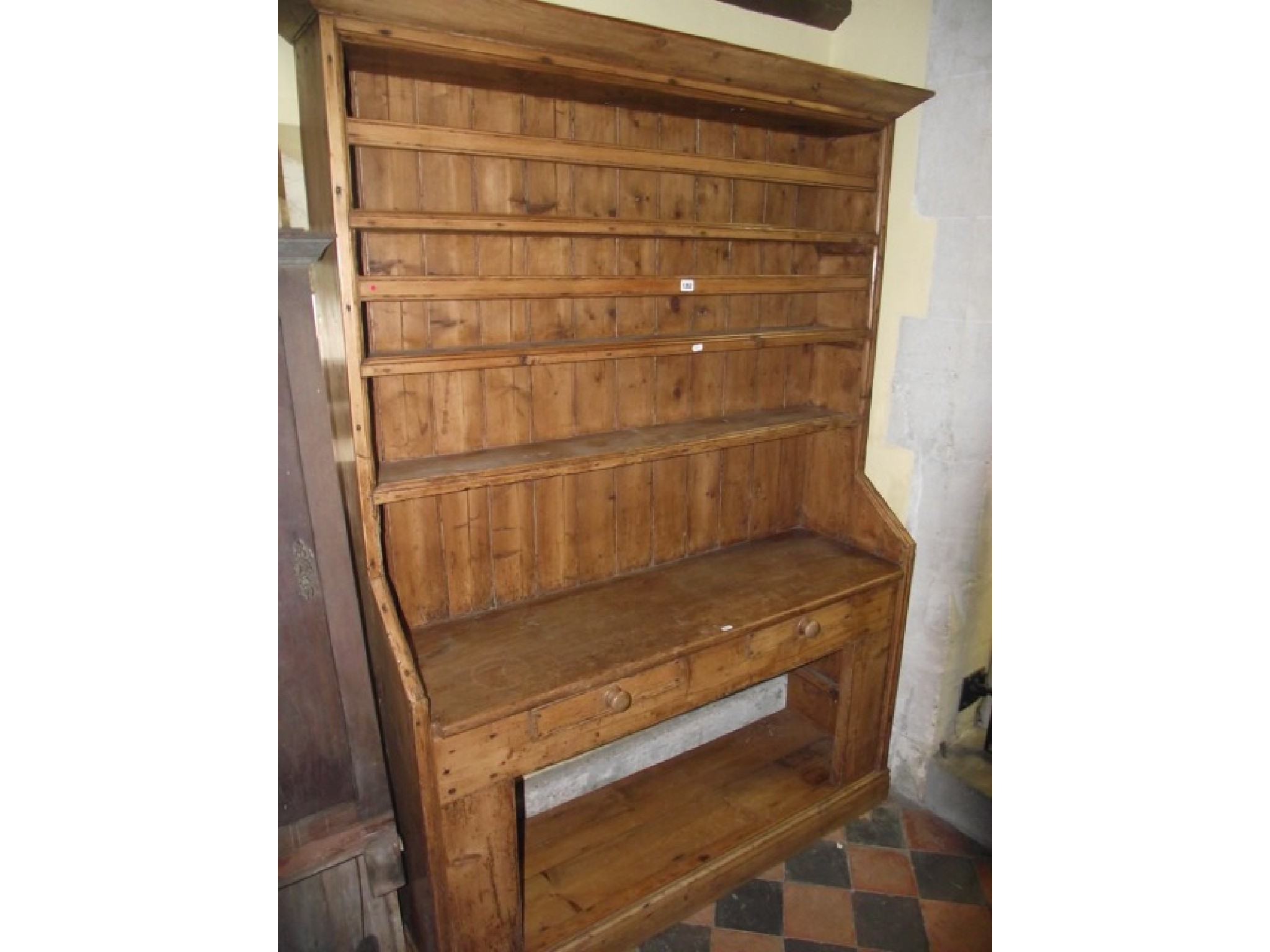 Appraisal: A Georgian Irish stripped and waxed pine dresser the base