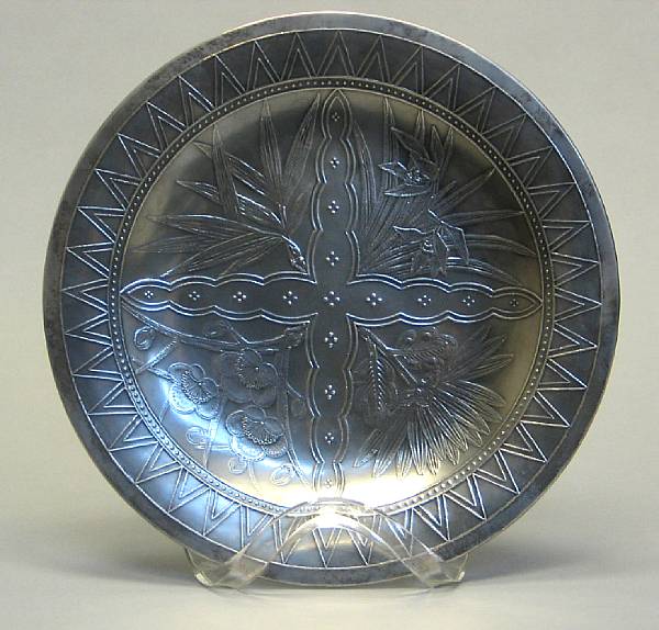 Appraisal: A Japanese embossed silver and yellow bronze circular dish signed