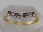 Appraisal: A carat gold diamond and amethyst seven stone ring finger