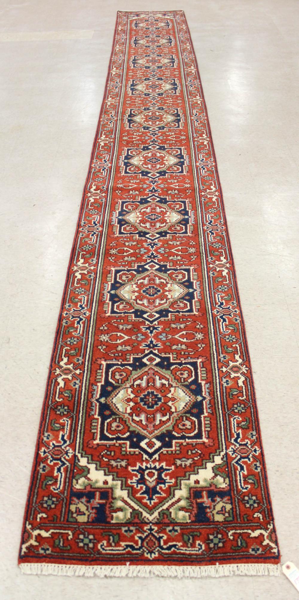 Appraisal: HAND KNOTTED ORIENTAL RUNNER Persian Serab design on red ground