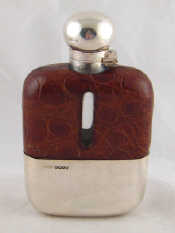 Appraisal: A leather cased silver hip flask with cup James Dixon