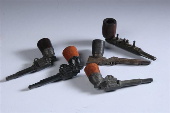 Appraisal: FIVE WHIMSICAL PIPES Three with revolver-form stems one with rifle-form