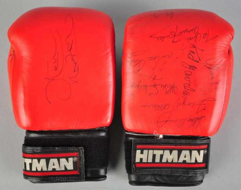 Appraisal: Pair of Hitman Autographed Boxing Gloves Description Includes signatures from