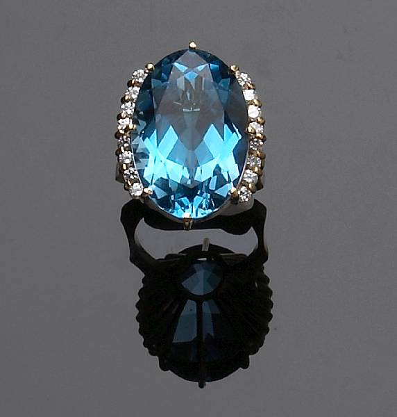 Appraisal: A blue topaz diamond and eighteen karat yellow gold ring