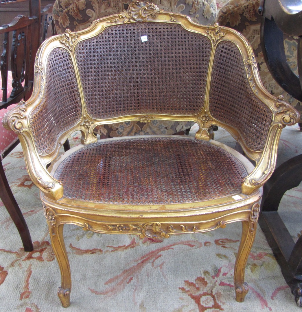 Appraisal: A Louis XV style gilt framed double bergere tub chair