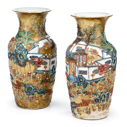 Appraisal: Pair of Chinese famille rose and applied ' boy' vases