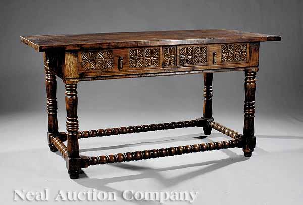 Appraisal: An Italian Renaissance-Style Carved Walnut Center Table plank top above