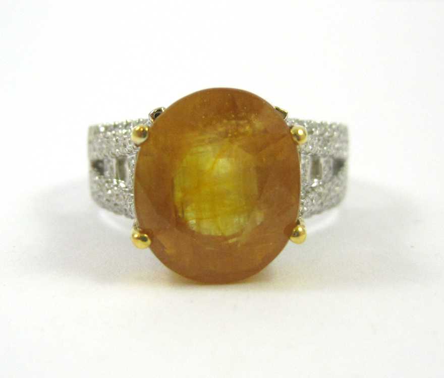 Appraisal: YELLOW SAPPHIRE AND FOURTEEN KARAT GOLD RING with AGI appraisal