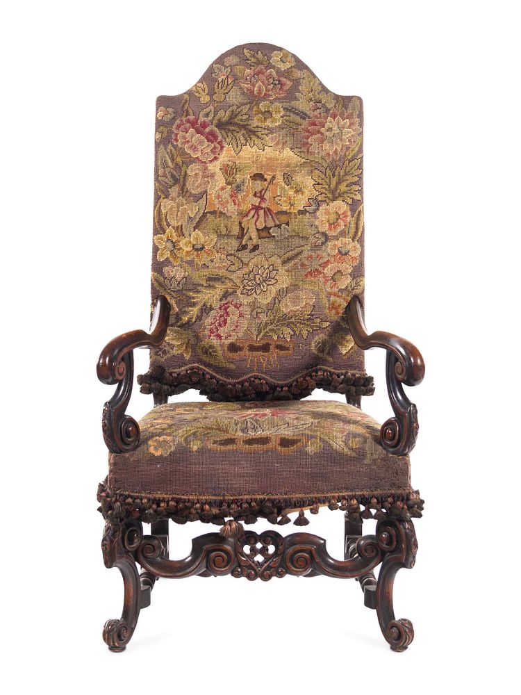 Appraisal: A William and Mary Style Carved Walnut Armchair with Needlepoint