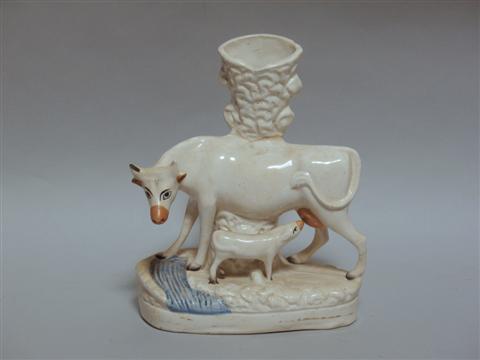 Appraisal: STAFFORDSHIRE SPILL VASE Modeled as a cow and nursing calf