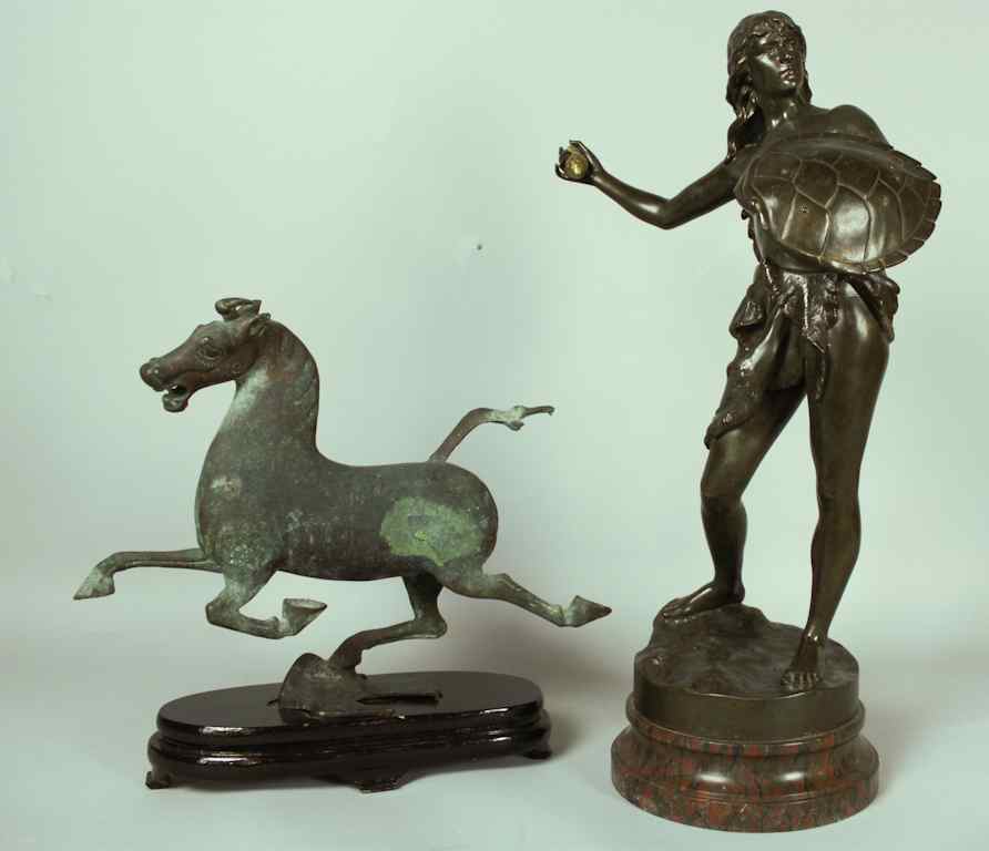 Appraisal: A BRONZE MODEL OF A GALLOPING HORSE Of rounded stylized