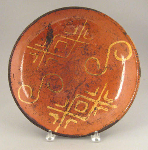 Appraisal: Redware charger th c with unusual yellow slip decoration dia