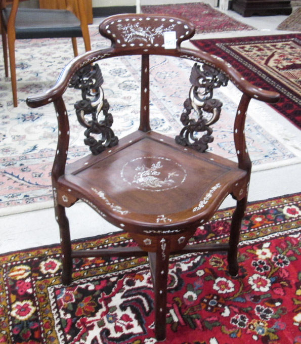 Appraisal: CHINESE MING STYLE CORNER ARMCHAIR of solid rosewood construction with