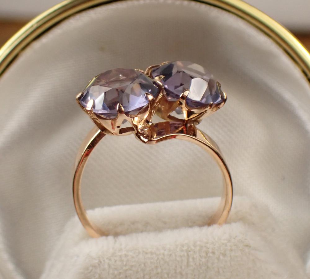 Appraisal: SYNTHETIC ALEXANDRITE AND FOURTEEN KARAT GOLD RING a crossover design