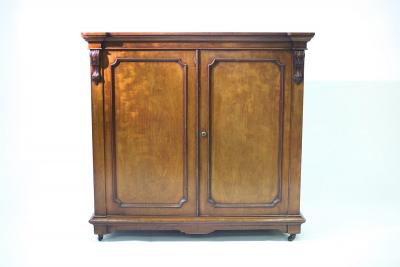 Appraisal: A th Century walnut cabinet the panel doors enclosing twelve