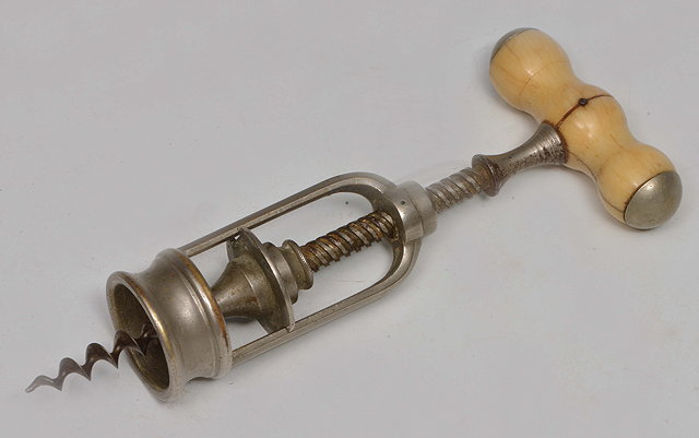 Appraisal: AN INTERESTING CONTINENTAL IVORY HANDLED CORKSCREW 'L'Excelsior' high