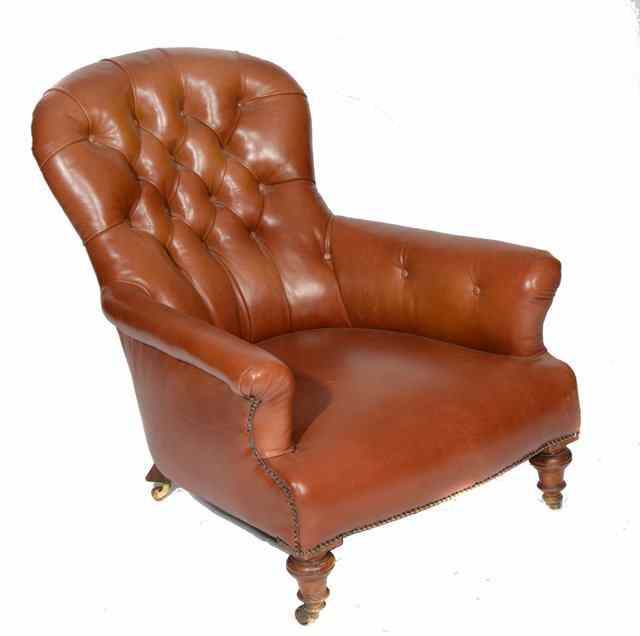 Appraisal: A VICTORIAN LOW EASY CHAIR upholstered in deep button brown