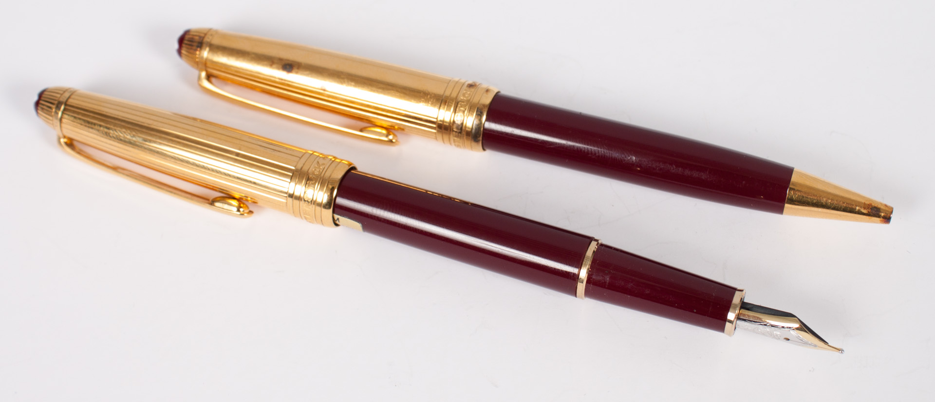 Appraisal: Two Montblanc Meisterstuck pens fountain and roller ball in burgundy